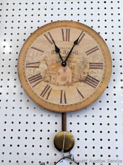 Howard Miller 'The Argyll Tavern' quartz wall clock is about 13" x 18" overall. In good condition,