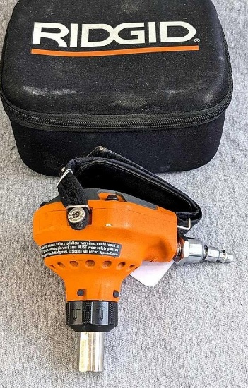 Ridgid pneumatic palm nailer with case, manual, oil. In good condition, about 5" tall as pictured.