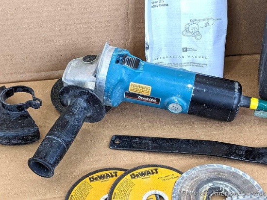 Makita 4-1/2" angle grinder comes with guard, wrench, case, manual, two DeWalt metal cutting wheels,