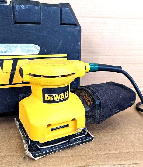 DeWalt DW411 palm grip sander comes with case, manual, sanding sheets, more. Runs and has a good