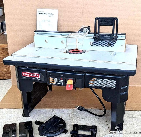 Craftsman router table with many attachments as pictured. Holes on feet to mount to your workbench,