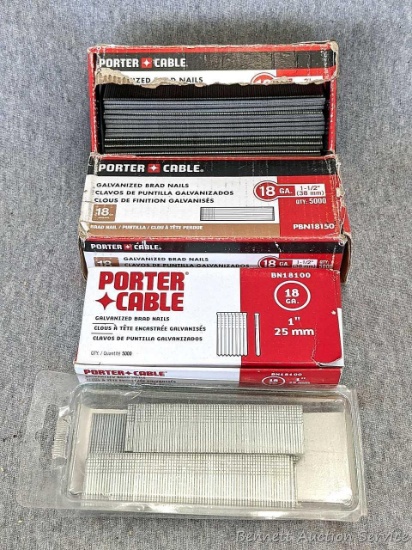 Four packages of Porter Cable 18 ga galvanized brad nails. Two smaller cardboard boxes nearly full,