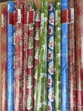 14 NIP rolls of Christmas and holiday wrapping paper. All are 40 sq ft