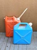 Pickup in Rib Lake. Pair of liquid containers. Larger 5.9 gallon orange container marked with