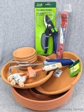 Plethora of planting supplies for your garden shed or your she-shed incl a mix of plastic and terra