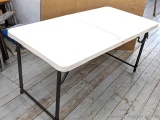 Pickup in Rib Lake. 4' folding table with legs extending table from 22