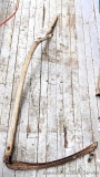 Pickup in Rib Lake. Antique scythe with grass blade.