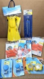 An assortment of kids pool accessories incl Aquaflow swimming fins, pool water thermometer, 2 sets