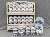 Wooden spice rack with matching porcelain spice jars and a matching Jam container and wall sconce;