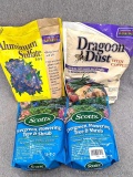 Two 3 lb bags of Scotts Evergreen, Flowering Tree and Shrub food, plus a 4 lb bag of Aluminum