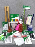 Assortment of supplies for the cabin incl sink plunger, feather duster, carabiner clips, dish