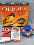 1 oriole feeder and 1 hummingbird feeder; 2 packages of instant nectar concentrate, one for orioles
