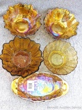 Five candy dishes of carnival glass; largest measures 7