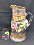 Pretty glass pitcher with gold trim and flowers painted on it with a matching glass; pitcher
