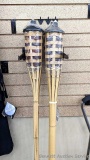 NIP Set of 4 Tiki Torches for the backyard measure 5ft tall.