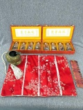 Oriental jewelry organizer; two boxes of glass bottles with stoppers - underside of lid is marked
