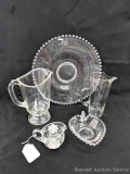 Eye-catching glassware incl 2 pitchers, small creamer, small heart-shaped dish, and large platter.