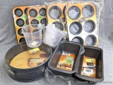 Spring form pan, bread pans, small and large muffing tins and liquid measuring cups.