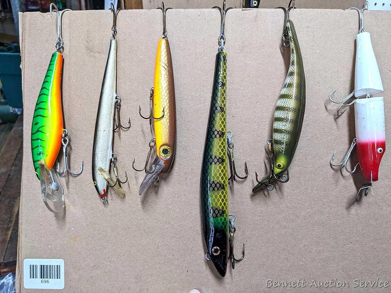 Six large fishing lures including Bagley's DB-06