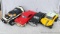 Variety of vintage kid's toy cars and a red 1957 Chevy VHS tape rewinder. No power cord for the
