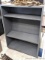 Steel shelving unit with positionable shelves is about 4' tall x approx 3' wide and 12-1/2