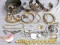 Gold and silver toned bangle and cuff bracelets, charm bracelet, Mother of Pearl accented necklace,