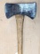 Double bit Old Timer brand axe ready to chop wood. Measures approx 3 ft overall.