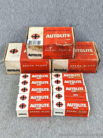 Two unopened boxes of Autolite spark plugs Models AL82 and BT4; and another BT4 open-but-full box. A