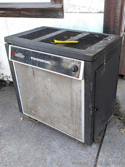 Wonderwood thermostat controlled wood burning circulator heater with manual and other papers. Made
