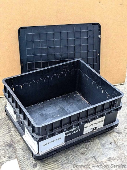 Two sturdy shipping containers are in good condition and would be handy for truck-bed storage.