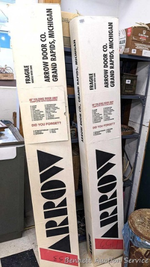 Pair of 48" Arrow Door Co folding door units complete with hardware still in box.