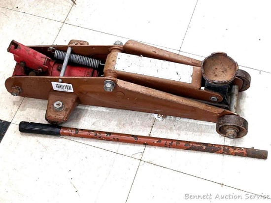 Floor jack with handle raises to about 15" and holds; lowers nicely too. 21" long.