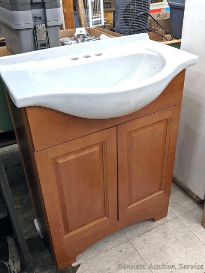Attractive Glacier Bay 25" Chelsea vanity combo is new. Sink measures 26-1/2" wide, sticks out
