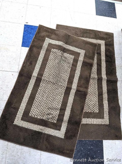 Pair of 31" x 52" rugs are in pretty nice condition, backing worn in some areas.