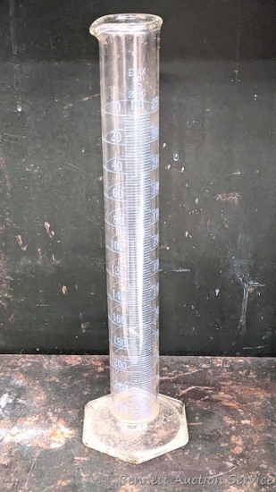 250 ml glass beaker by Exax is in good condition with no chips or cracks noted. Stands 13" tall.
