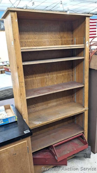76" tall wooden shelf unit is 3' wide and 1' deep over cabinet part. Handy piece.