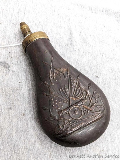Italian muzzleloader black powder flask has a copper body and brass fittings. Plunger nozzle works.