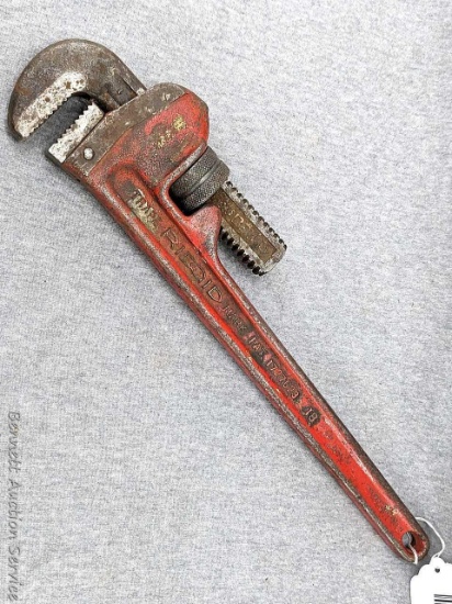 Ridgid 18" pipe wrench with good sharp jaws and a straight handle.