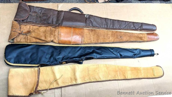 Four gun cases, leather and other. Rifle cases up to 59". Deerskin or similar in pretty nice
