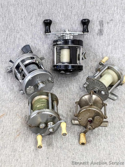Vintage and newer reels including Pflueger Summitt Model 1993L; Hendrix Level Wind and Bronson