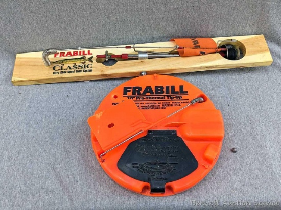 Frabill tip-ups, one is 10" Pro-Thermal Tip-up and the other is approx 23-1/2" long classic wooden