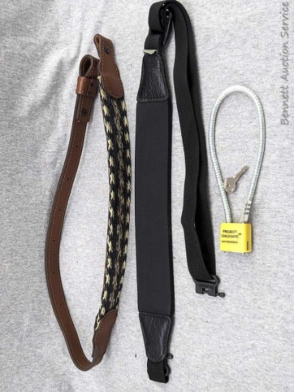2 firearm gun slings and a gun lock device with keys. Braided sling measures approx 38" long, black
