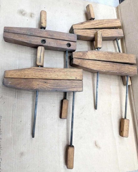 Set of four adjustable wooden claps with 10" and 12" long wooden jaws.