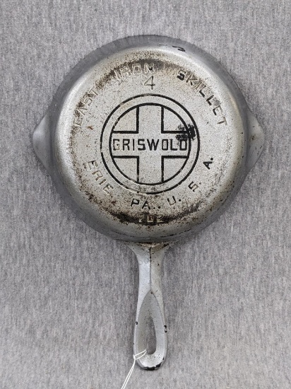 Griswold No. 4 cast iron skillet with nickel plating and large logo. Bottom marked Erie PA USA, 702.