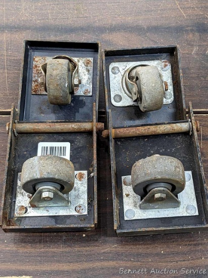 Set of four 2-1/2" casters mounted on 7" x 4-1/2" platforms. Three pins incl. 2 swiveling, 2