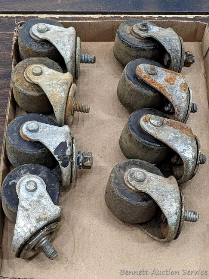 Eight 2-5/8" swiveling casters are ready for a cart.