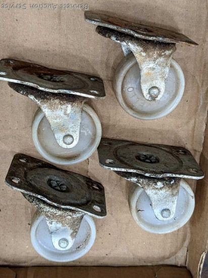 Four swiveling Flexello casters with wheels about 2-1/2" wide. Mounting brackets about 3-3/4" x