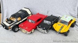Variety of vintage kid's toy cars and a red 1957 Chevy VHS tape rewinder. No power cord for the