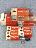 Three boxes of Autolite BT6 spark plugs look like they match boxes. Small amount of rust noted on