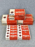 Two unopened boxes of Autolite spark plugs Models AL82 and BT4; and another BT4 open-but-full box. A